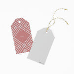 2 gift tags with a geometric lattice pattern in pink, with a space for personalized message. 1 showing the front and the other showing the back