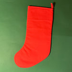 back of the Red and green chinoiserie Christmas stocking with a pagoda design on a green background