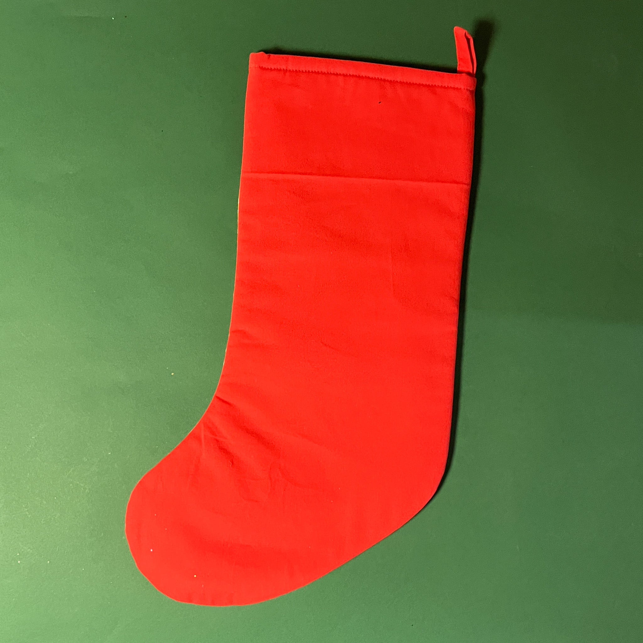 back of the Red and green chinoiserie Christmas stocking with a pagoda design on a green background