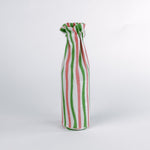 Madcap Cottage Striped wine glass bag  with green, pink, and white pattern on a white background