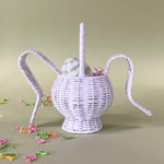 white rattan bunny easter basket with egg in it back view