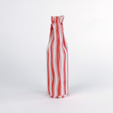 Madcap Cottage Red and white striped bottle on a white background