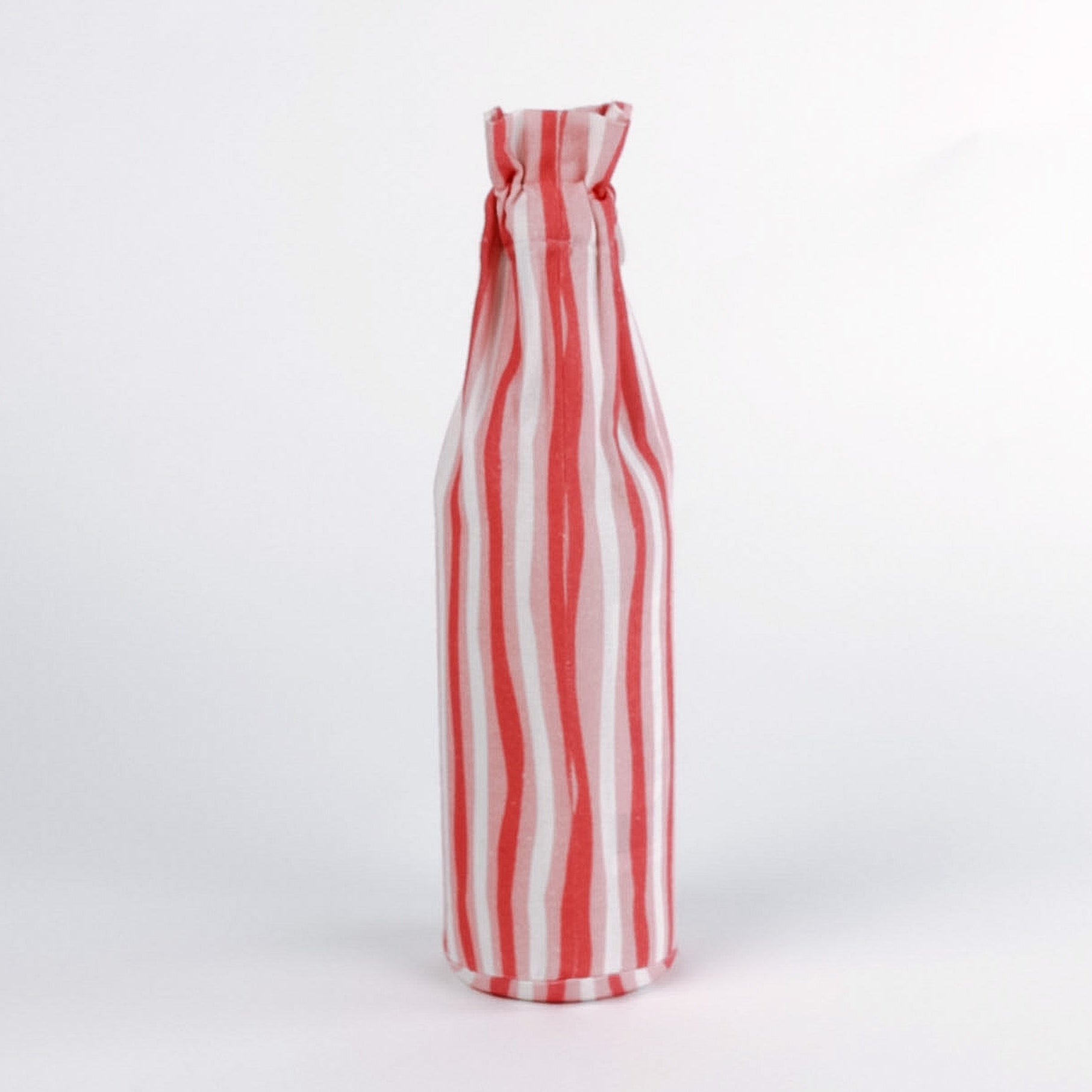 Madcap Cottage Red and white striped bottle on a white background