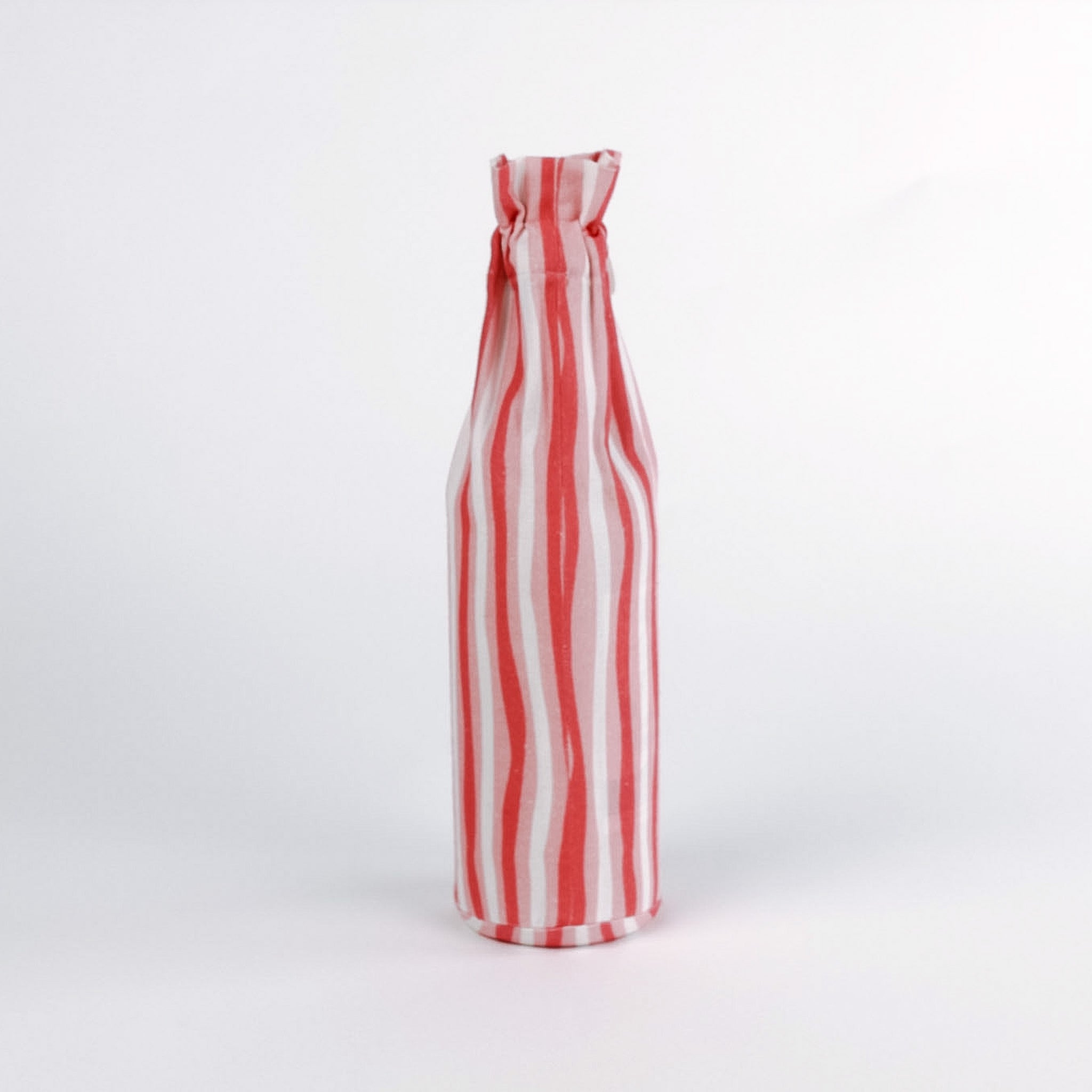 Madcap Cottage Red and white striped bottle on a white background