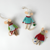 back of the Three felt mouse ornaments dressed in colorful holiday sweaters—one with a snowman, one with a wreath, and one with a Christmas tree—each holding a gift.