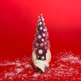 back of a White Vintage Arched-Neck Ceramic Swan w/Pink Glitter Christmas Tree Centerpiece against a red background. 