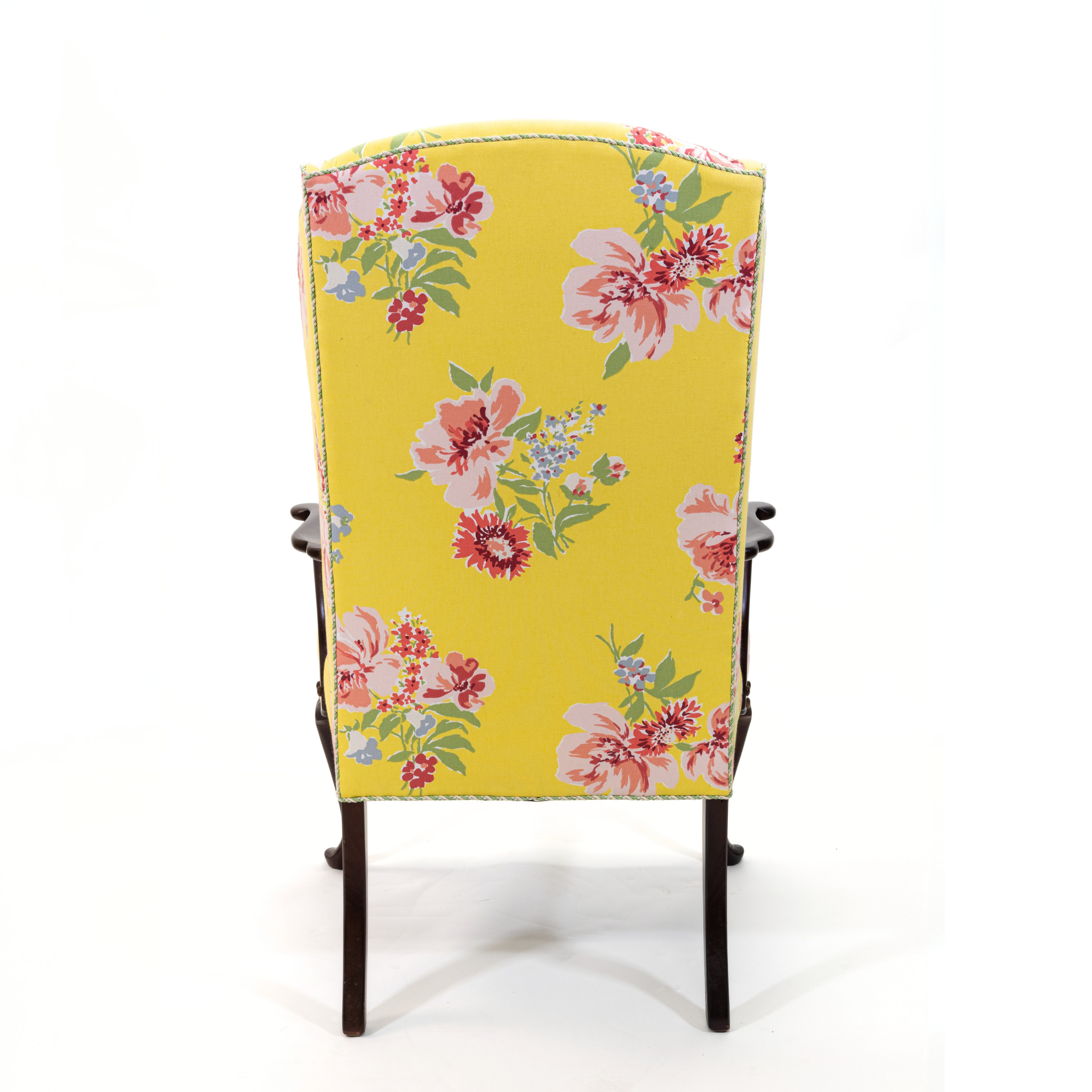 a yellow vintage floral armchair