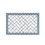a blue and white floral paper placemats on a white background