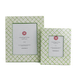 Two Bahama Court white and green hand painted photo frames on a white background