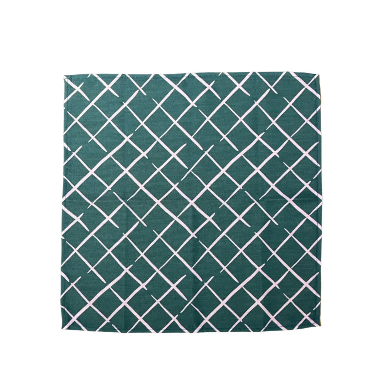 green dinner napkin featuring a trellis pattern from madcap cottage fabric.
