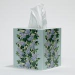 a blue floral tissue box cover with a repeating hydrangea pattern down the center of each side. 