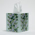 a blue floral tissue box cover with a repeating hydrangea pattern down the center of each side. 