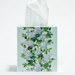 a blue floral tissue box cover with a repeating hydrangea pattern down the center of each side. 