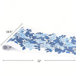 A blue and white floral paper table with blue hydrangea pattern on a white background and product dimension arrows that read 19.5" and 12'