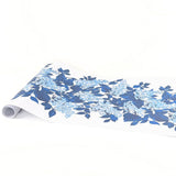 A blue and white floral paper table with blue hydrangea pattern on a white background
