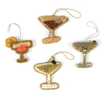 Set of four cocktail-themed Christmas ornaments on a white background