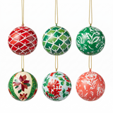 Six decorative hanging Christmas ornaments shaped like spheres, each with a different festive hand-painted pattern in red, green, cream, and coral on a white background.