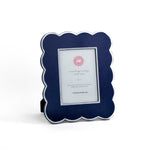 Blue 5 x 7 scalloped photo frame on a white background