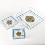 a blue square Acrylic Trays in different sizes with Ornament motifs on them on a white background