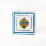 a small blue square Acrylic Trays with Ornament motif on it on a white background