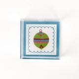 a small blue square Acrylic Trays with Ornament motif on it on a white background