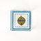 a small blue square Acrylic Trays with Ornament motif on it on a white background