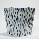 a blue and white wastepaper basket with a brushtroke motif pattern called club house from madcap cottage