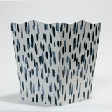 a blue and white wastepaper basket with a brushtroke motif pattern called club house from madcap cottage