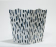 a blue and white wastepaper basket with a brushtroke motif pattern called club house from madcap cottage