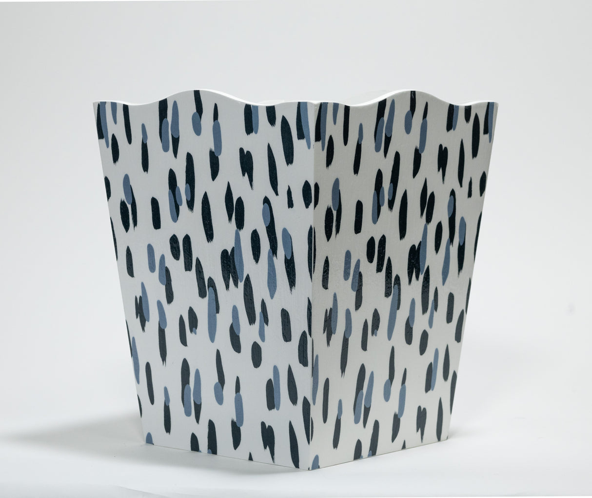 a blue and white wastepaper basket with a brushtroke motif pattern called club house from madcap cottage