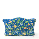 Back of Blue floral upholstered loveseat with botanical pattern and rolled arms