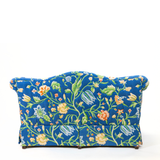 Back of Blue floral upholstered loveseat with botanical pattern and rolled arms