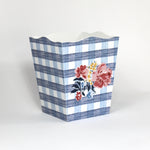 a blue floral wastepaper basket in a gingham pattern with a central floral motif from madcap cottage. 