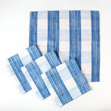 Set of blue and white striped cloth napkins arranged together.