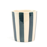 A blue striped ceramic cup in on a white background. 