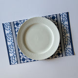 blue lattice paper placemat with white plate on top view table setting