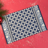 blue lattice patterned paper placemat with decorative border on table setting
