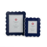 Two blue scalloped photo frames on a white background