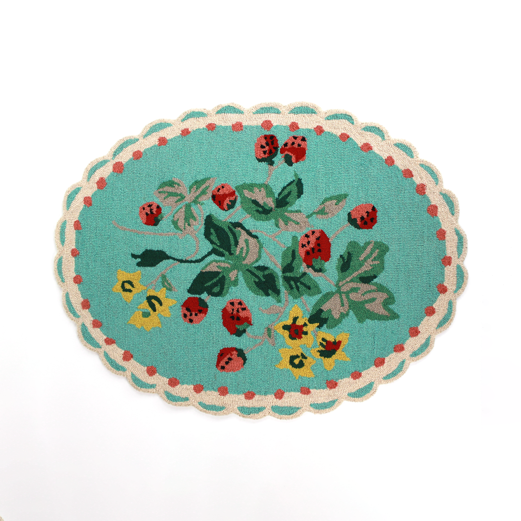 A blue oval rug with strawberry and flower motifs and a scalloped border