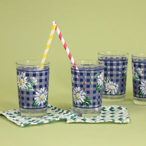 vintage drinking glasses featuring a blue gingham and daisy pattern. 