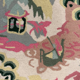 a close up of the boatman on an Old Peking pink and green rug with chinoiserie motifs from madcap cottage