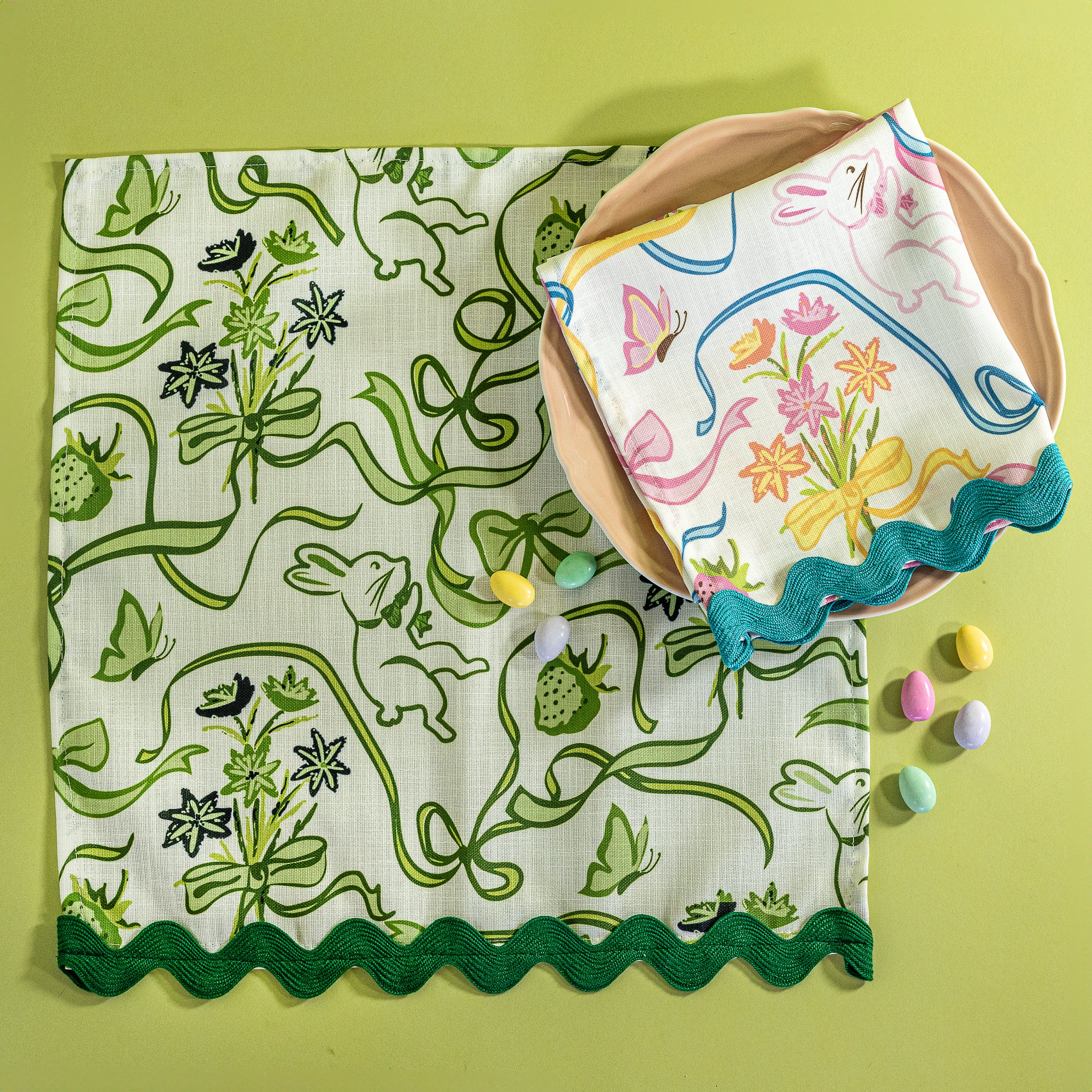 Bunnies and bow print cloth napkins in green and multicolor.