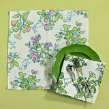 Easter napkins in a bunny and strawberry print fabric, one in green, the other in multicolor. 