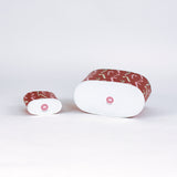 Two decoupage Dancing Candy Canes Christmas caddies with a candy cane pattern, one large and one small, placed on a white background. Showing their bottom