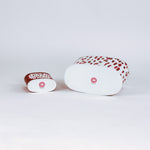 bottom of 2 madcap Cottage caddies with red abstract patterns on a white background