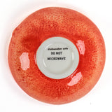grapefruit shaped ceramic bowls with a textured surface on a white background