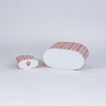 bottom of 2 madcap Cottage caddies with red abstract patterns on a white background