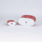 bottom view of Empty duo of Lobster and Ribbons caddies in large and small on a green background