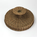 the underside of brown rattan pedestal bowl from madcap cottage