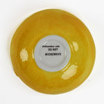 bottom side of a lemon shaped ceramic bowl